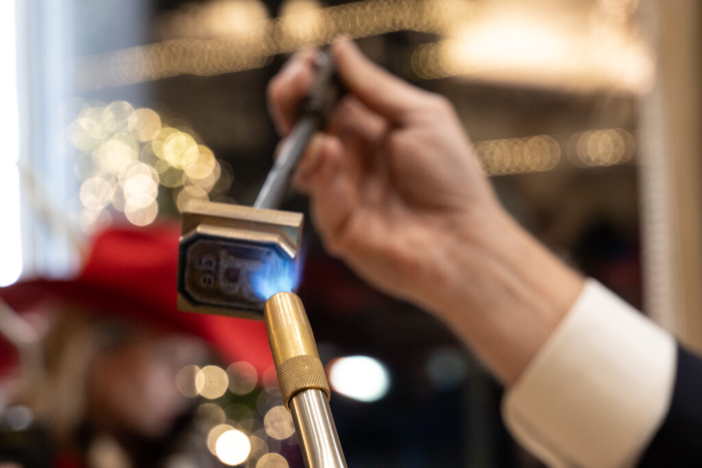 From there, customers brandished their hats with a monogram and the deBoulle logo. (Photo by George Fiala)