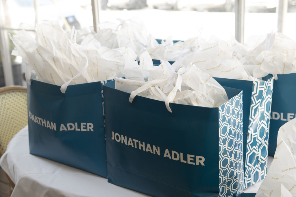 Guests' gift bags included a ceramic canister that resembled a dollop of meringue. (Photo by Tamytha Cameron Photography)