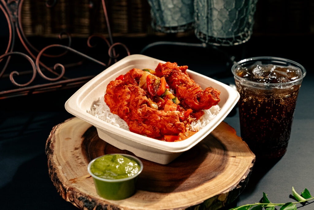 The Loaded Rice & Shine ($11.99) at Pok Pok Po combines steamed basmati rice (made every four hours to ensure its freshness) with crispy chicken thigh or breast, house-made sauce, and desi kimchi. (Photo by Alex Montoya)