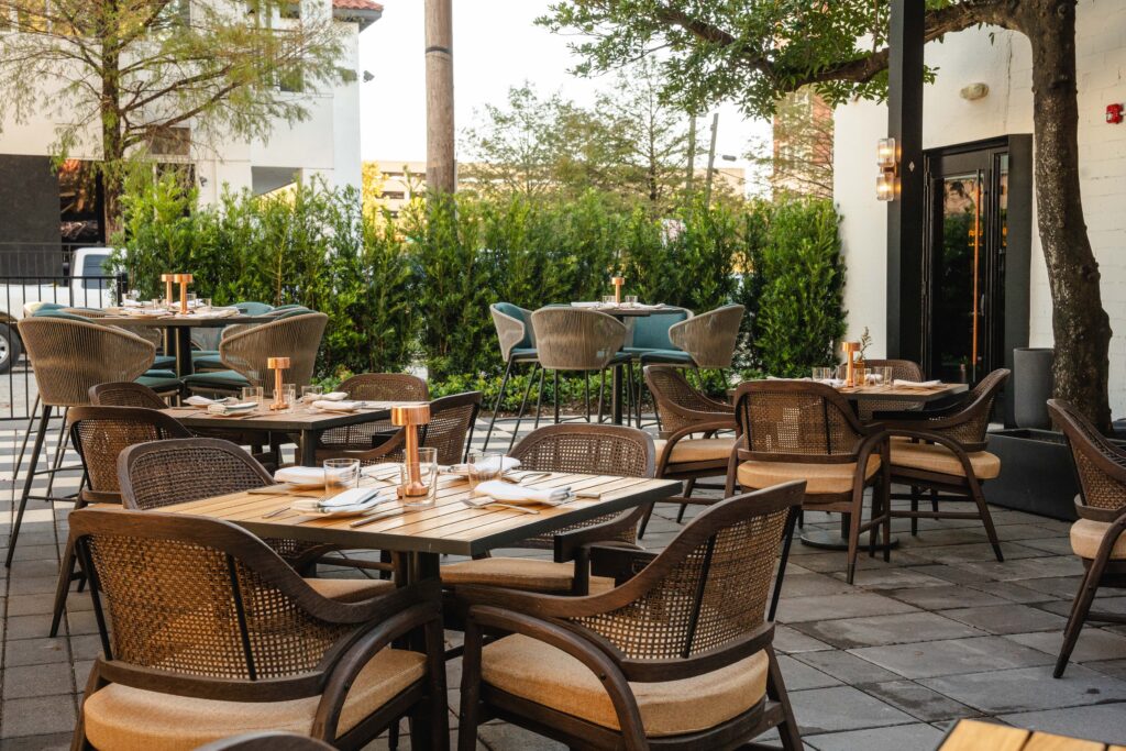 For his most ambitious project yet, Sambrooks initially enlisted the award-winning Manhattan interior design firm AvroKO to fashion Andiron and brought them back this year to complete the spacious patio that lends itself to a more convivial, drop-by-anytime vibe. (Photo by Michael Anthony)