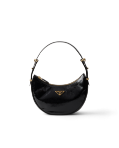 Prada Arqué naplak patent leather shoulder bag, $2,750, available at the Prada boutique