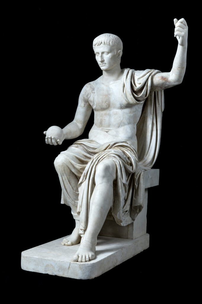 "Statue of Emperor on Throne with Portrait of Augustus" showcases the power and legacy of Roman leadership. (Photo by Lorenzo De Masi, Courtesy of Torlonia Foundation)