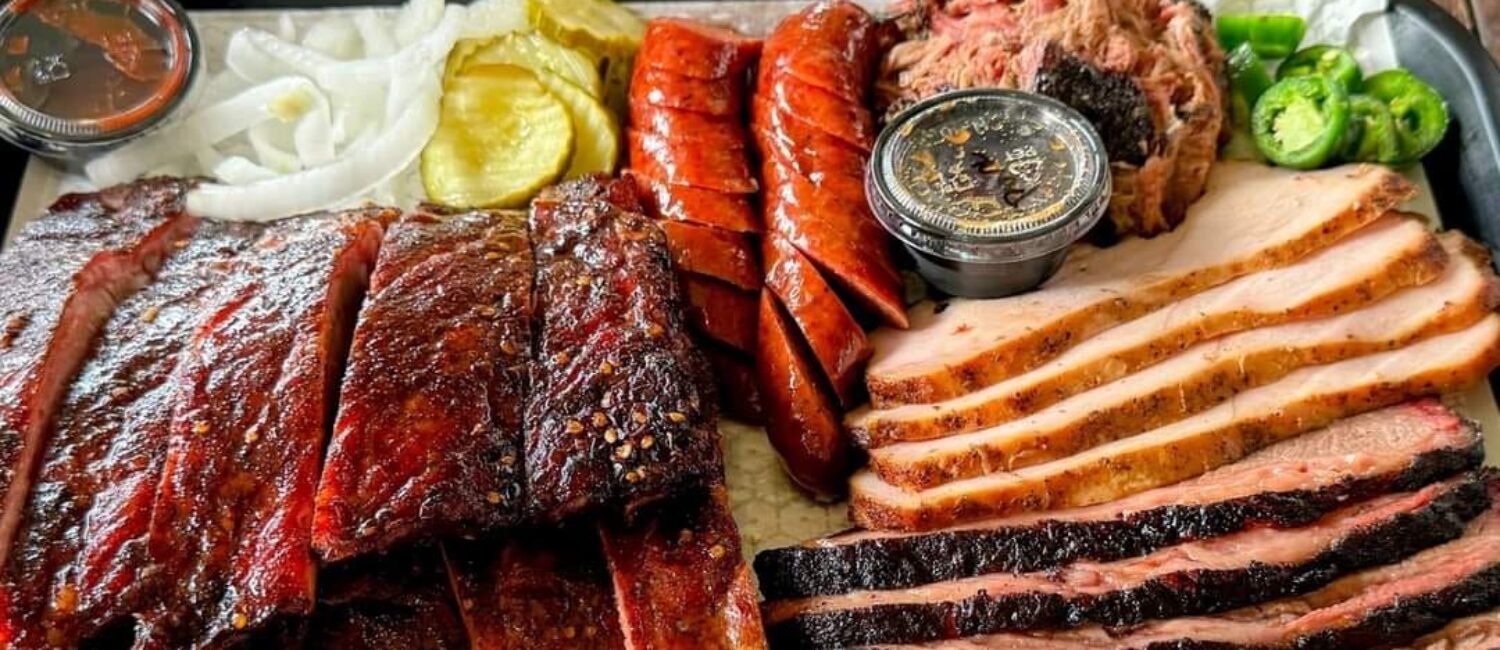 A mouthwatering platter of meats and sausages from Corkscrew BBQ shows its Michelin star-worthy power.