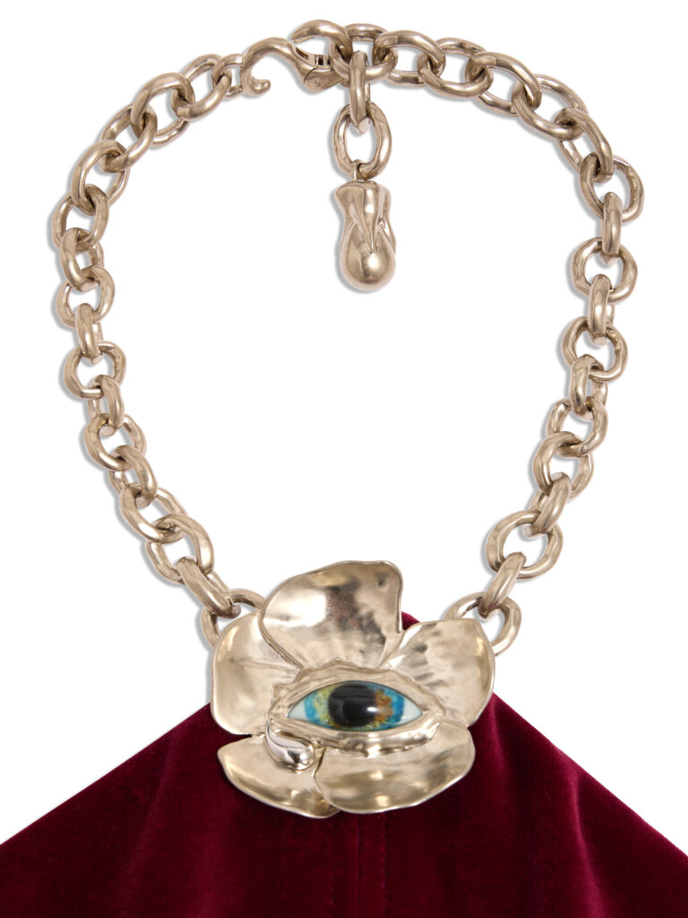 The evening gowns feature bijoux "codes" from the house, including the surrealist eye. (Courtesy of Schiaparelli)