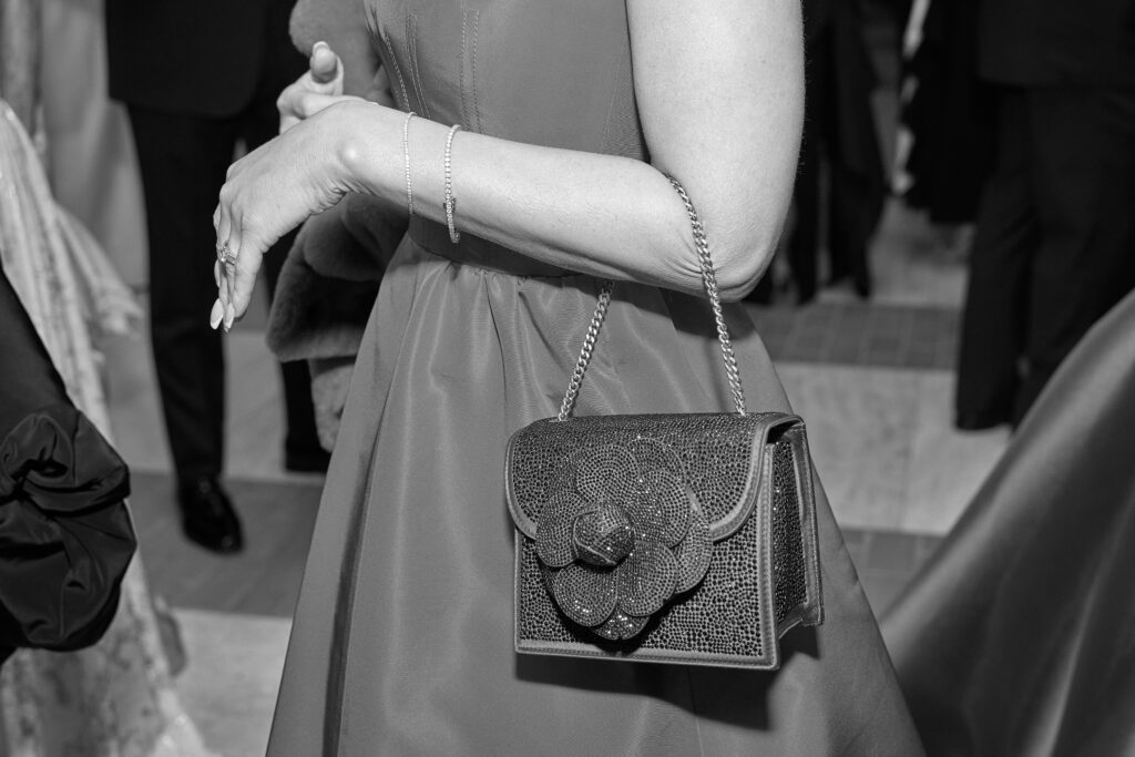 The black tie affair brought out chic clutches and glamorous handbags. (Photo by Nate Rehlander)