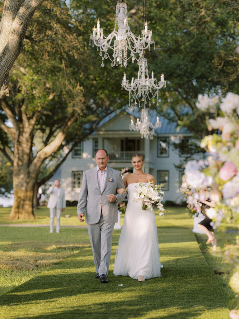 Bob Wempe walks his daughter, Dana, down the aisle for her marriage to Blake Fertitta (Photo by Joseph West Photography)