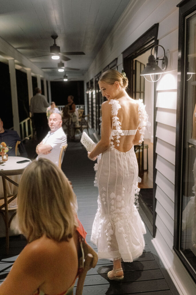 The bride changes into another gown for the reception held at the farm guest house. (Photo by Joseph West Photography)