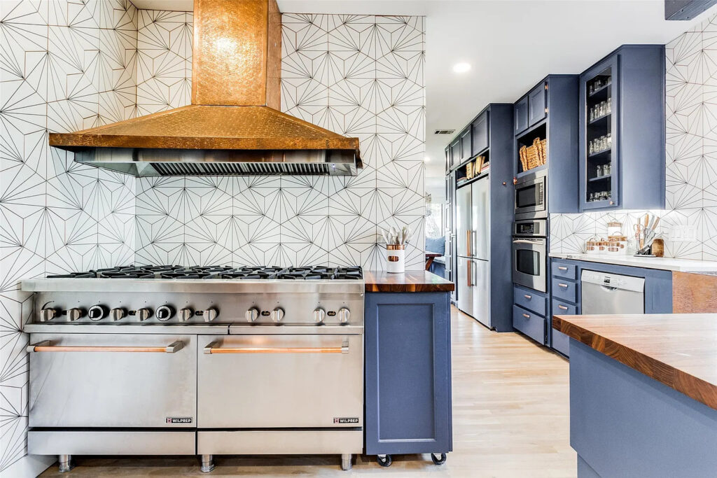 If you owned this house, surely your guests would congregate in the kitchen, admiring your gorgeous range.