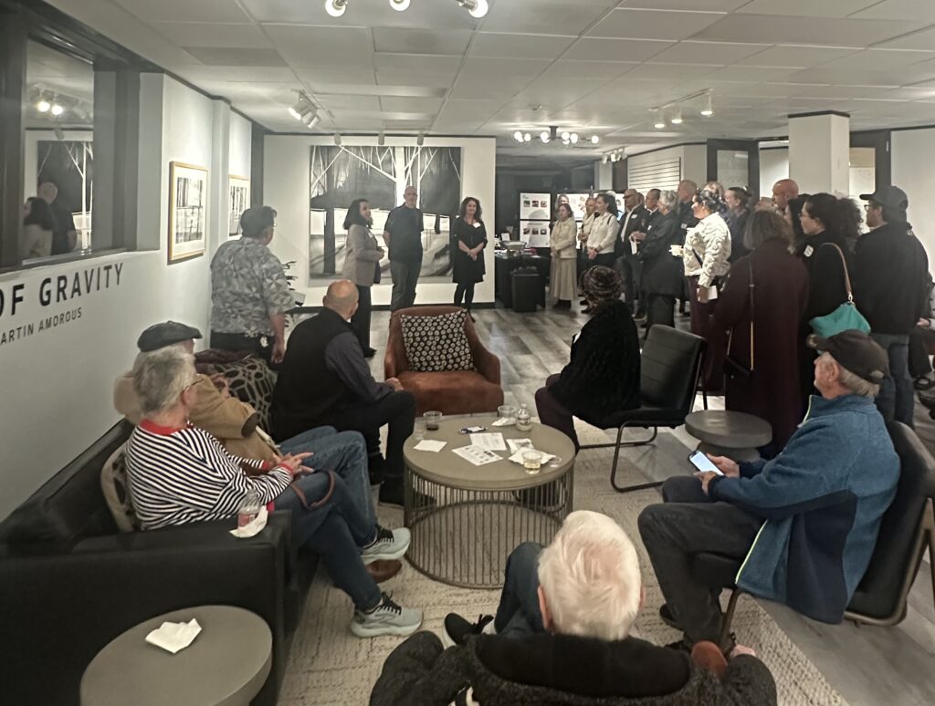 The Woodlands Arts Council's Executive Director Jenny Carattini Wright introduces artist Martin Amorous with exhibit curator Annette Palmer at The Woodlands Arts Council's offices.