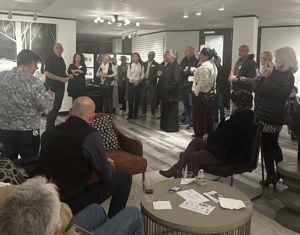 Painter Martin Amorous spoke at length about his technique of pouring paint and rotating canvases at the opening reception for his solo show "The Poetry of Gravity" at The Woodlands Arts Council's exhibit space.