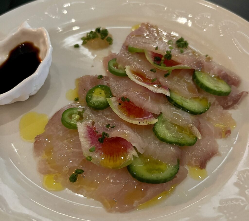 Hugo's Seafood Bar serves a raw bar of rotating specials like yellowtail crudo. (Photo by Megan Ziots)