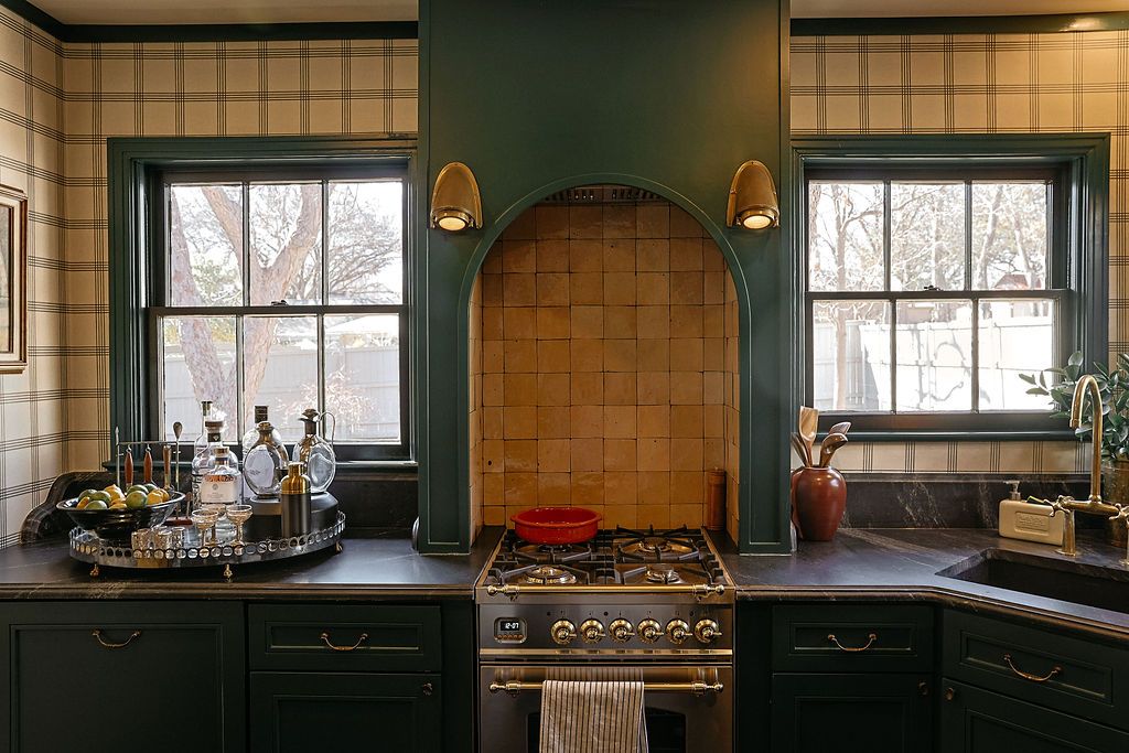 A stainless and brass gas range anchors the kitchen at 5015 Stoneleigh Avenue. (Photo by Beckley)