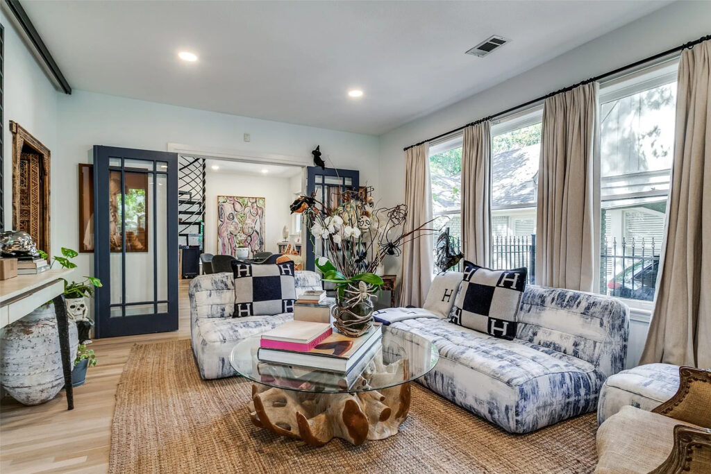 The front door of the bungalow opens to the living room, and then French doors connect it to the dining room.
