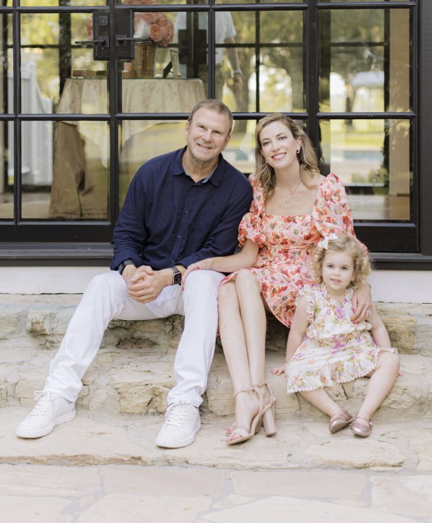 Tilman & Lauren Fertitta and their daughter Elle at the Fertitta/Wempe wedding at the family farm. (Photo by Joseph West Photography)