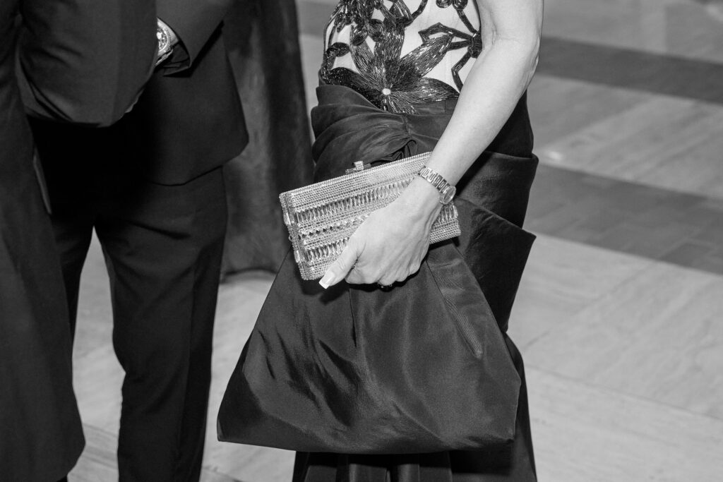 A little rain didn't keep the ladies from donning the most black tie of black tie gowns for the annual occasion. (Photo by Nate Rehlander)