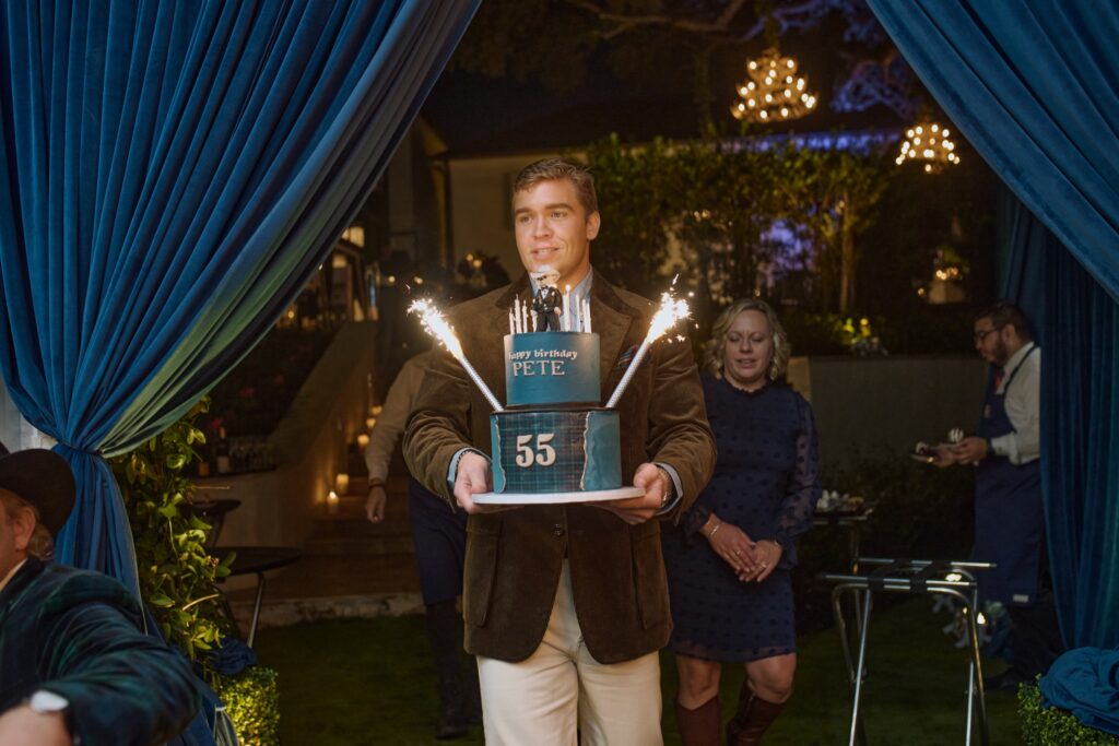 Hunter Bell delivers the birthday cake for his father, Pete Bell.