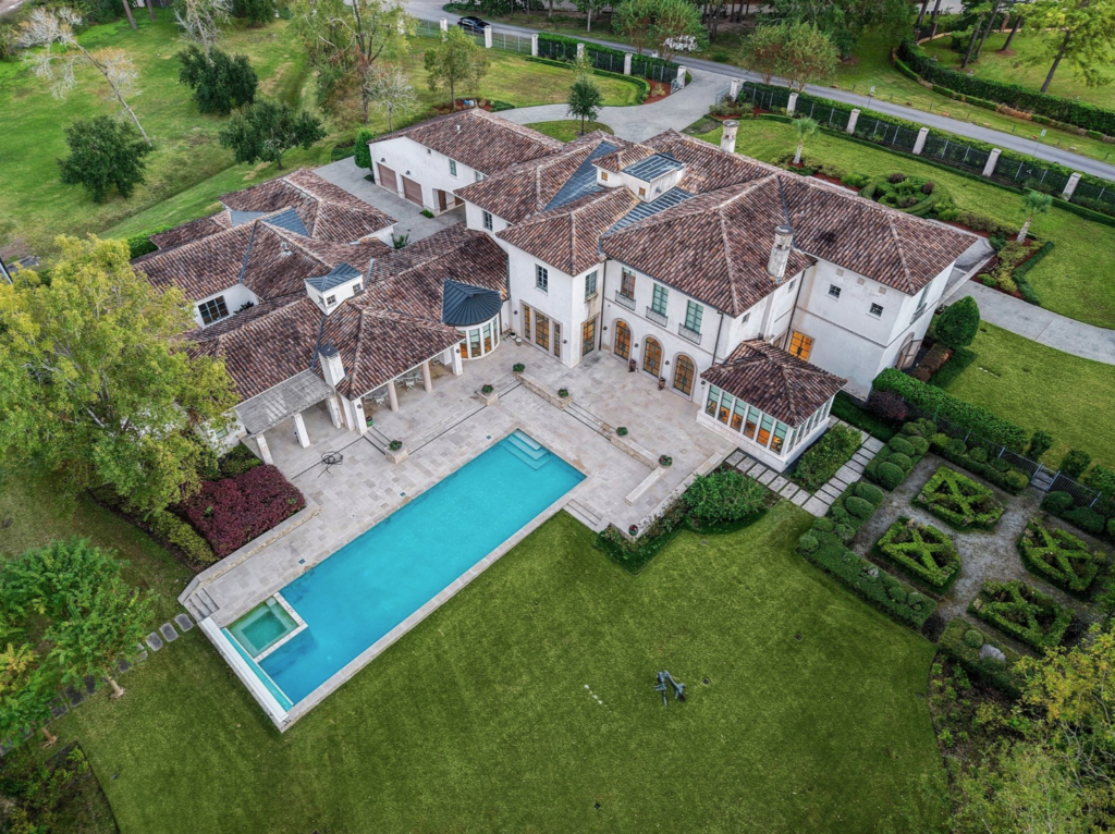 The home at 119 Carnarvon Drive sits amid two carefully landscaped acres. (Photo by Patrick Bertolino for Martha Turner Sotheby's International Realty)