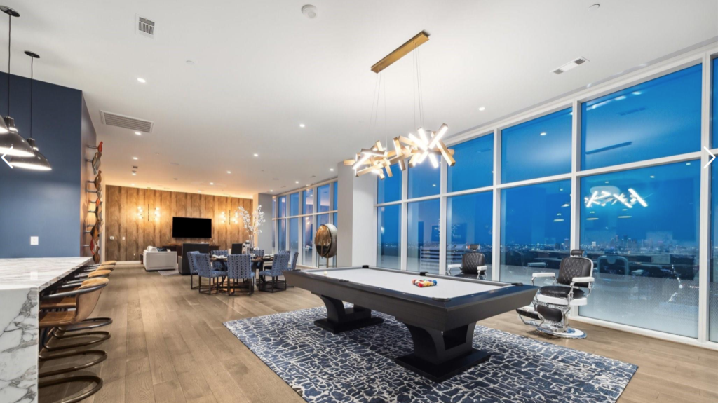 The open concept living space with floor-to-ceiling windows in No. 3202 at 4521 San Felipe offers unobstructed views.