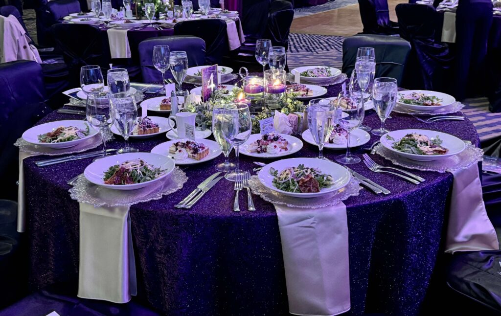 Even the tables shimmered in violet with stunning centerpieces at the Mosaics' Gala. (Photo by Jillian Richstone) 
