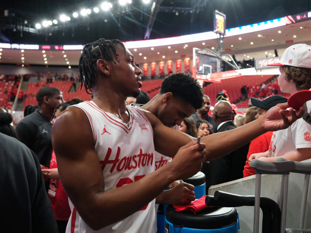 University of Houston true freshman guard Mercy Miller signs autographs for the fans. (Photo by F. Carter Smith)