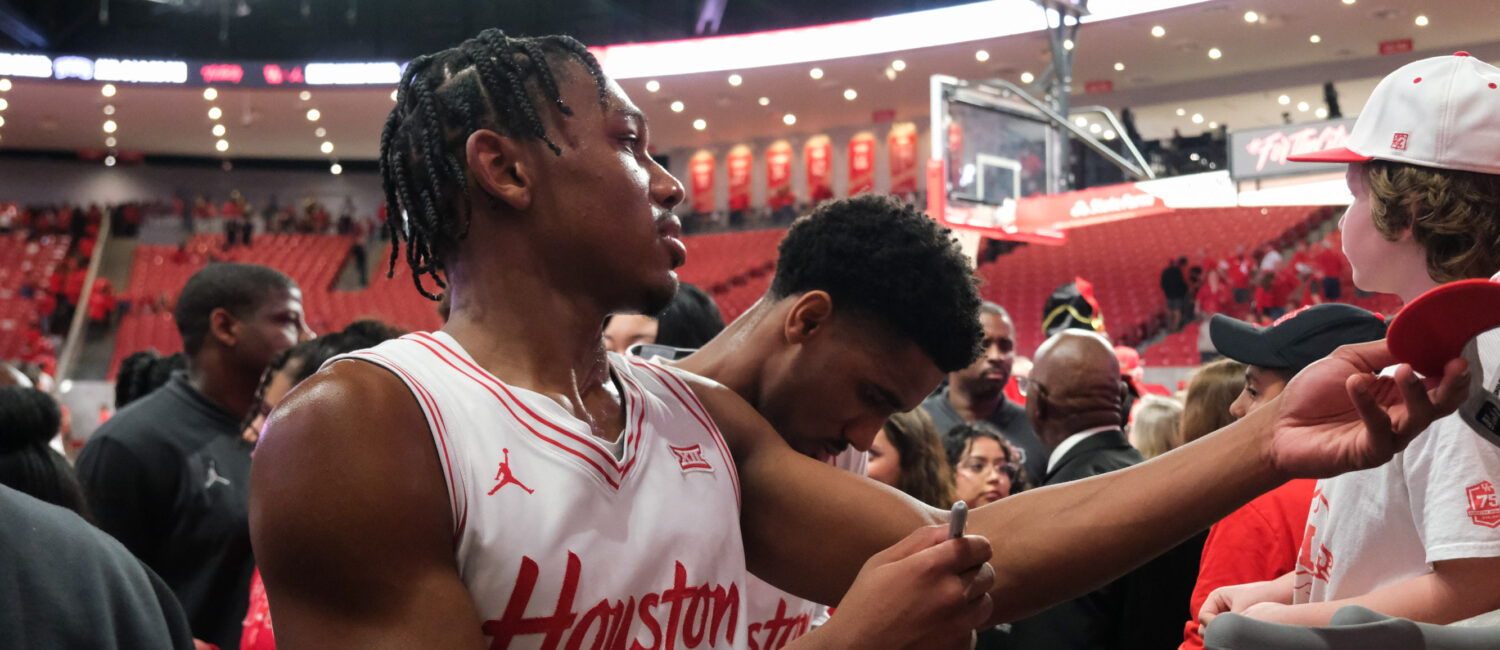 University of Houston true freshman guard Mercy Miller signs autographs for the fans. (Photo by F. Carter Smith)