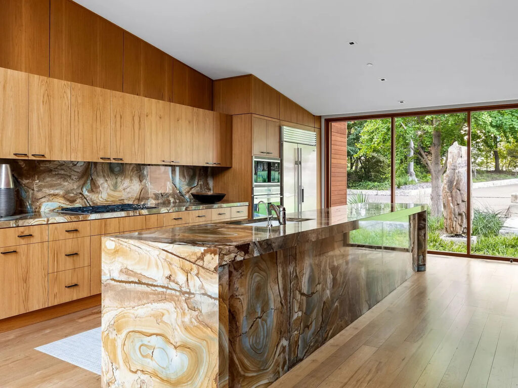 Dramatic features abound, including a 20-foot-long kitchen island. (Photo courtesy of Allie Beth Allman & Associates)