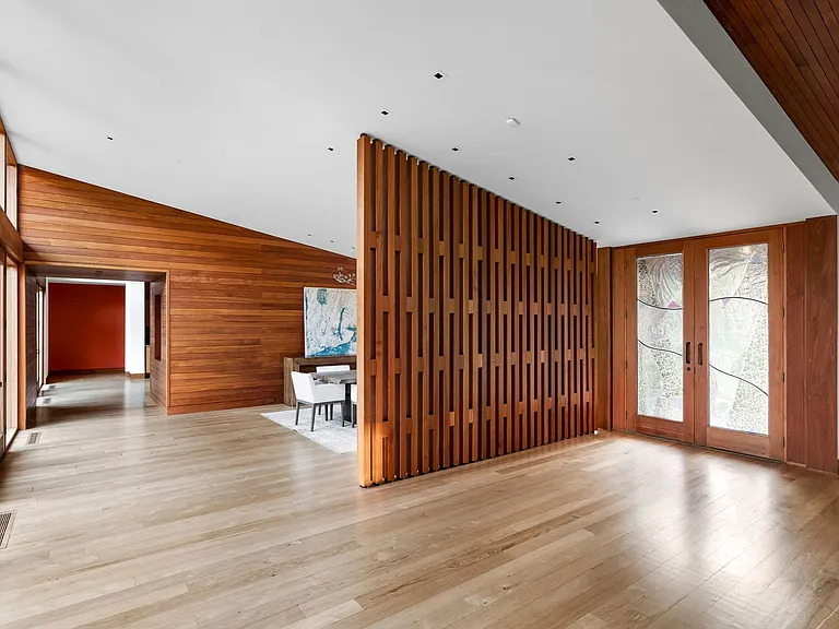 The listing boasts that the house "combines unparalleled craftsmanship with finishes sources globally," including "teak wood from Myanmar, recycled hardwoods from India, Brazilian limestone, and quartz stone from South America." (Photo courtesy of Allie Beth Allman & Associates)