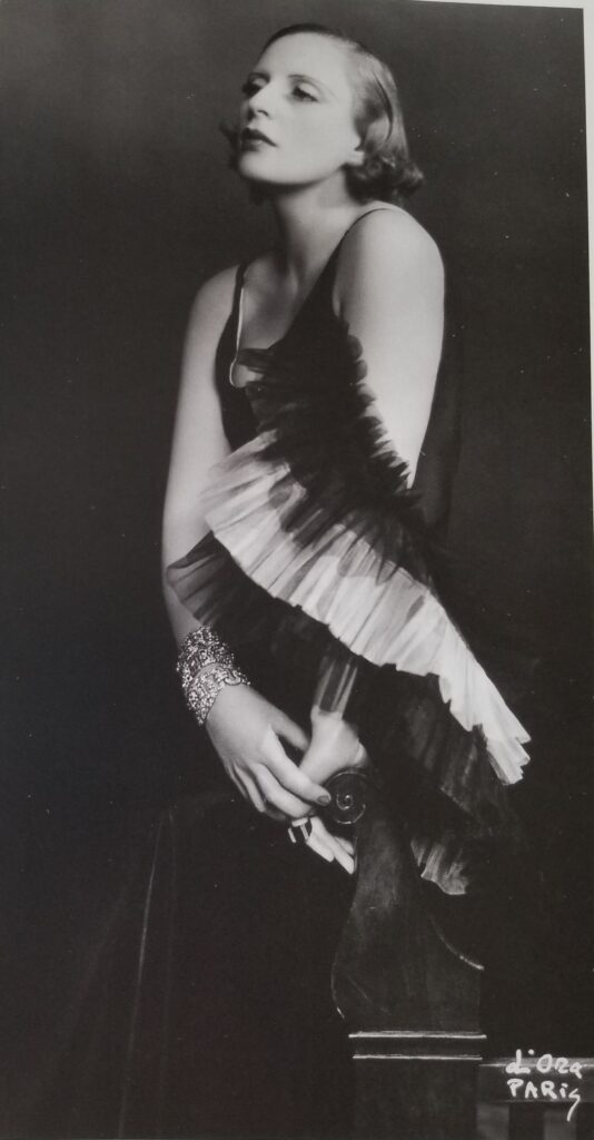 Tamara de Lempicka wearing Marcel Rochas, 1933. (From the book Tamara de Lempicka by Gioia Mori and Furio Rinaldi, Yale University Press © 2024. Photo by Madame d’Ora)