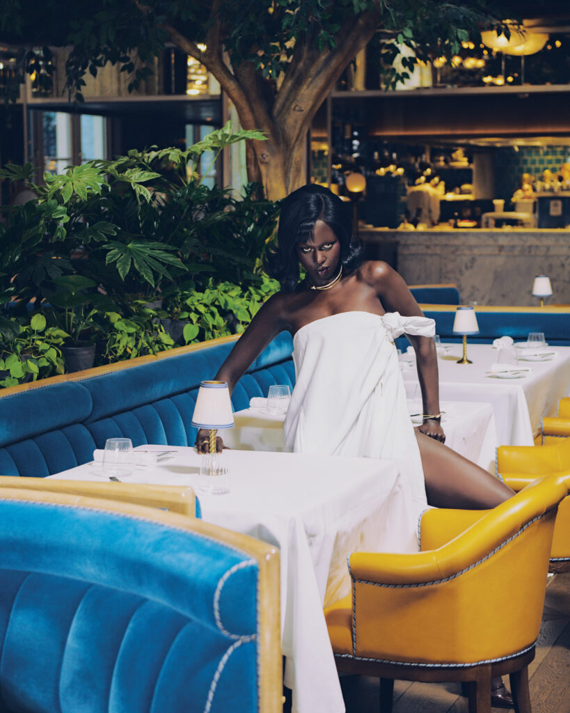 Moschino knot detail strapless white gown $6,895, at The Conservatory. All jewelry from Tiffany & Co. (Photo by Khristio)