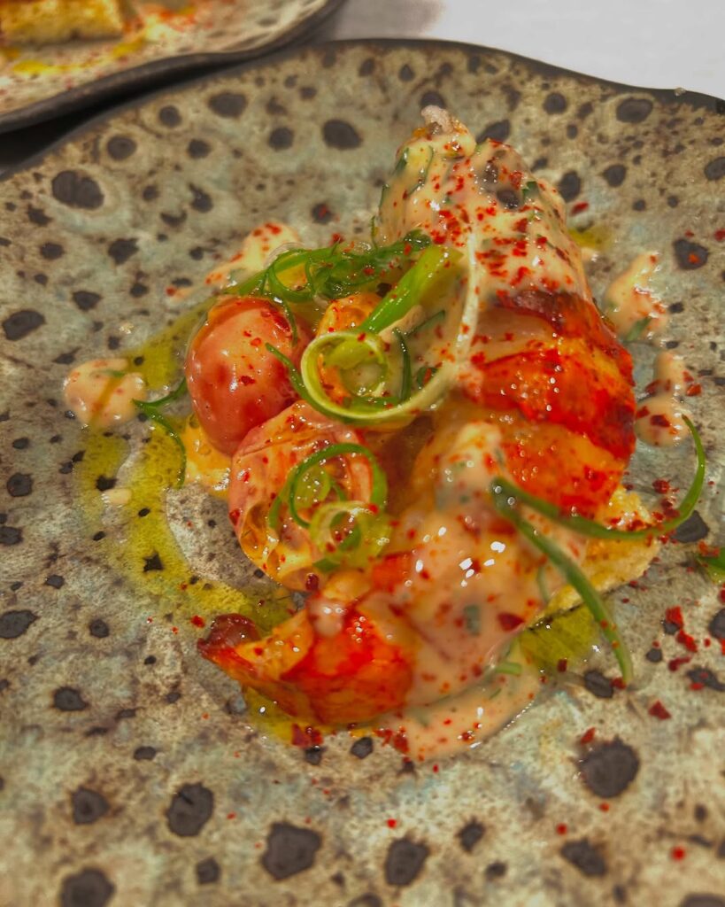 A lobster, brioche, tomato and citrus brown butter emulsion from Chef and Rancher's Austin Simmons shows his skill.