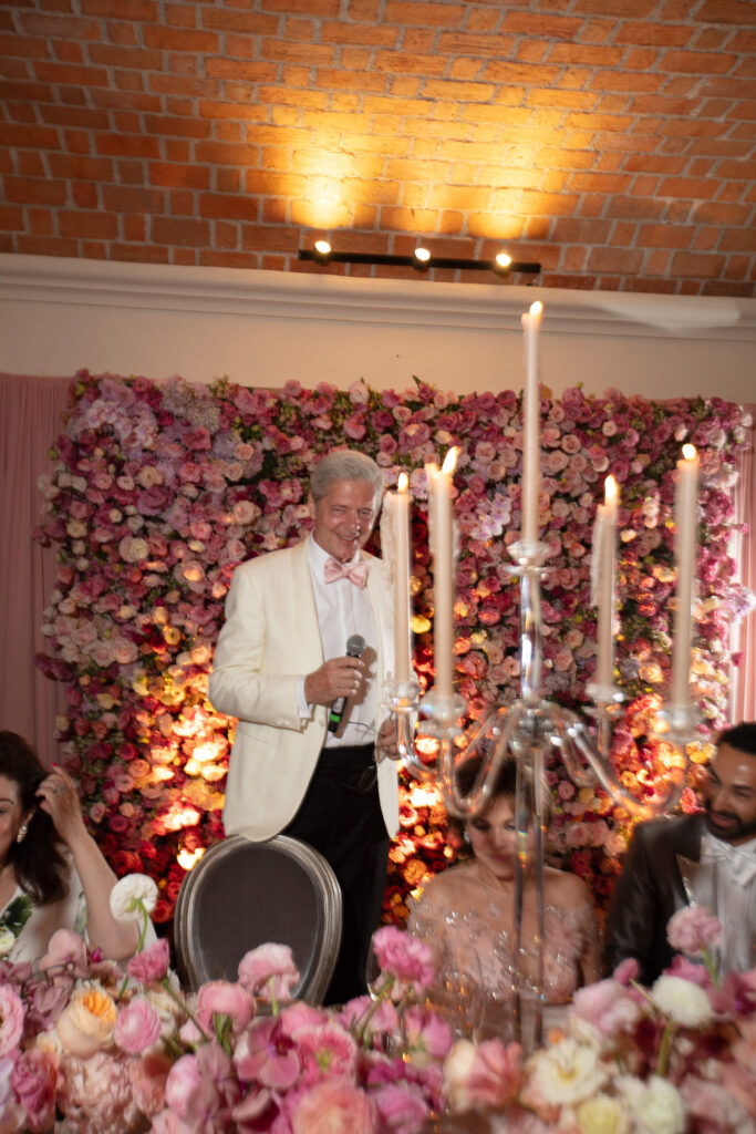 The groom toasts the tight knit group of friends invited to the destination wedding. (Photo by Kara Martinez)