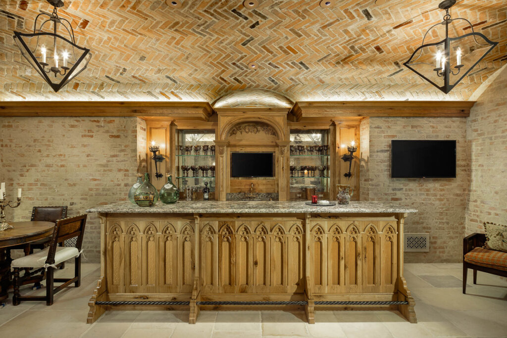The basement offers a full bar and temperature-controlled cellar for wines and champagnes. (Photo by Briggs Freeman Sotheby's International Realty)