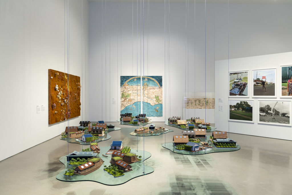 Tiffany Chung's work, featured in the "Breath(e): Toward Climate and Social Justice" exhibit, includes stored in a jar: monsoon, drowning fish, color of water, and the floating world on display. (Photo by Jenny Antill Clifton) 