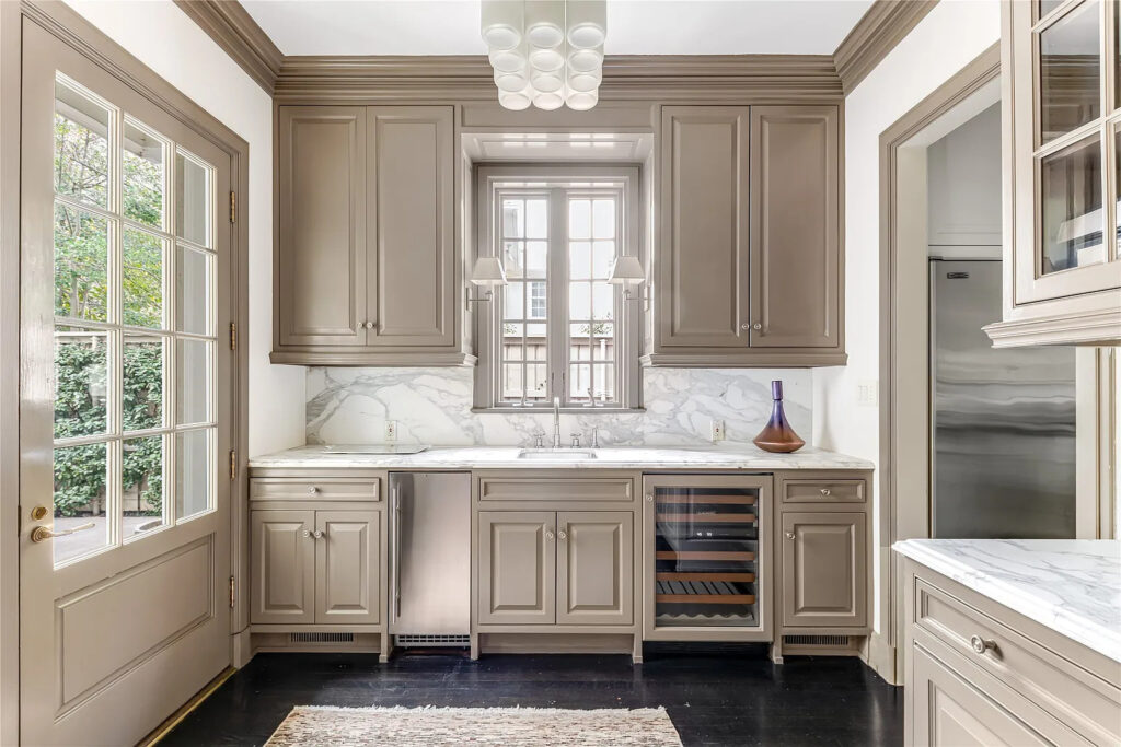 Ideal for entertaining, the kitchen includes a commercial-grade range and a butler's pantry for additional storage. (Photo by Allie Beth Allman & Associates)