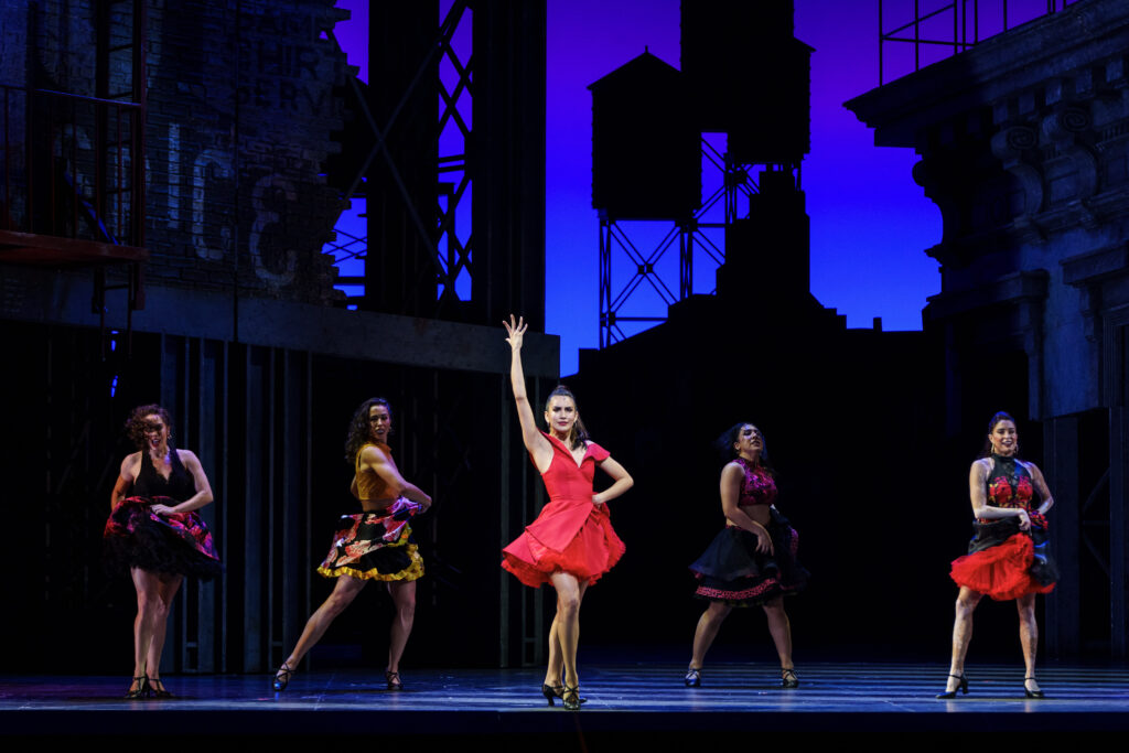 Yesenia Ayala as Anita and cast members dancing at the final dress rehearsal of West Side Story presented by the Houston Grand Opera. (Photo by Michael Bishop)