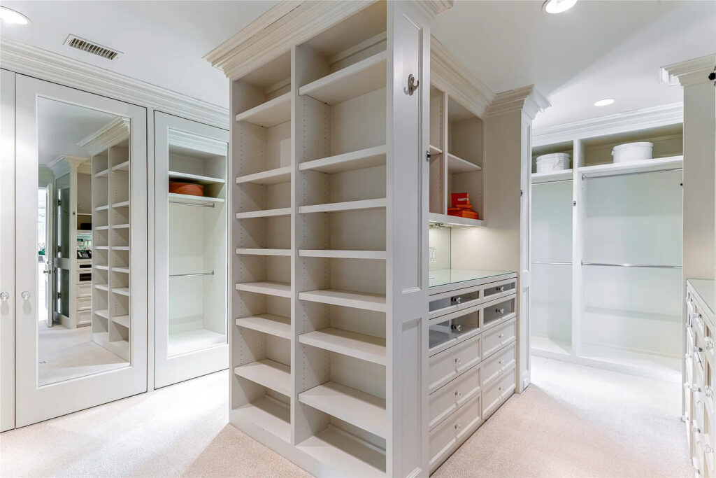 Take your time dressing for the day, running your fingers through your collection of Chanel tweed jackets housed behind the dressing room's mirrored doors. (Photo by Allie Beth Allman & Associates)