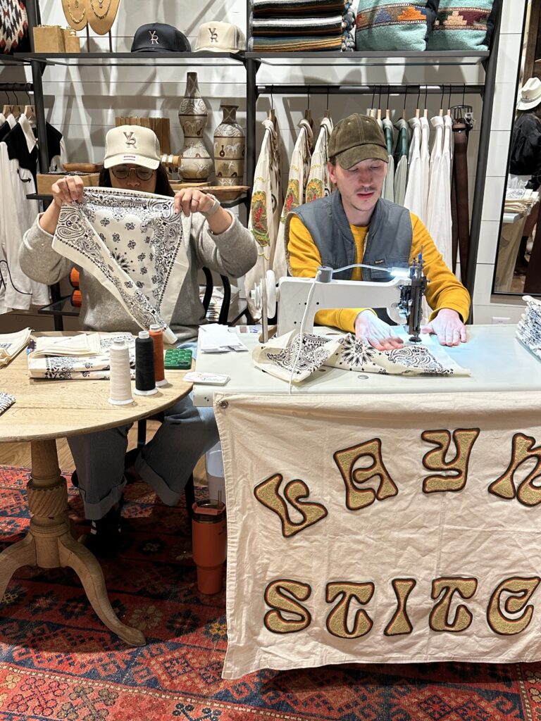 The opening night festivities at the Heights Mercantile Yellow Rose by Kendra Scott boutique featured monogramed bandanas. (Photo by Shelby Hodge)