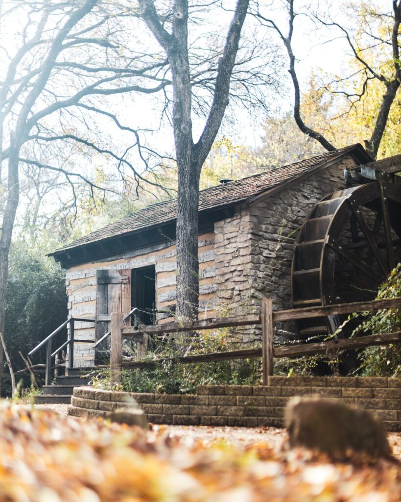 Log Cabin Village brings Texas’ frontier past to life with historic log homes, a working gristmill, and blacksmith demonstrations. (Courtesy)