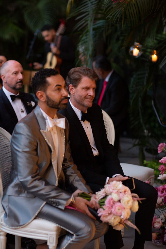 Fady Armanious, holding the bride's bouquet, & Bill Baldwin at the Halllie Vanderhider & Bobby Dees wedding (Photo by Kara Martinez)