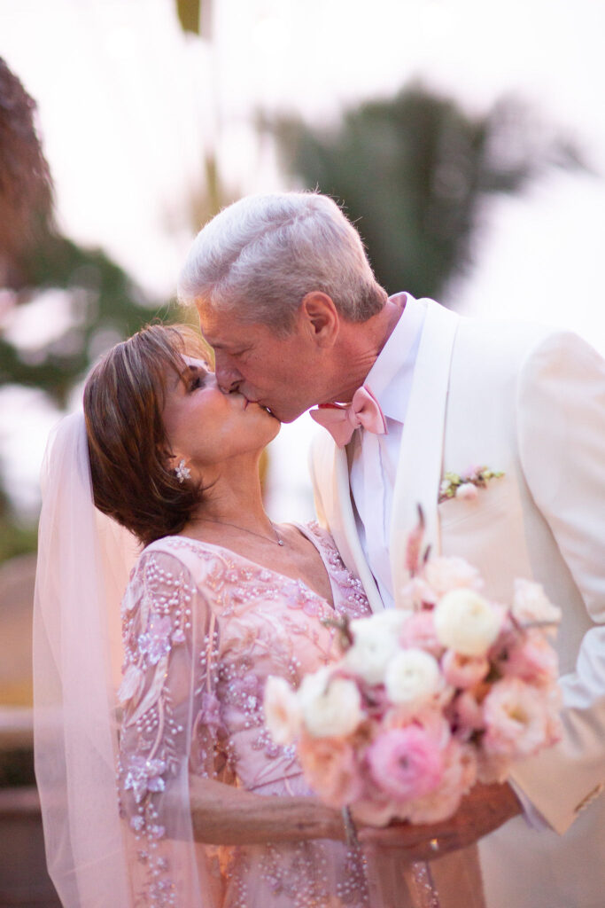 Note the hand-beaded detailing on the Pamela Rolland wedding gown by Pamela DeVoss, the bride's personal friend.  (Photo by Kara Martinez)