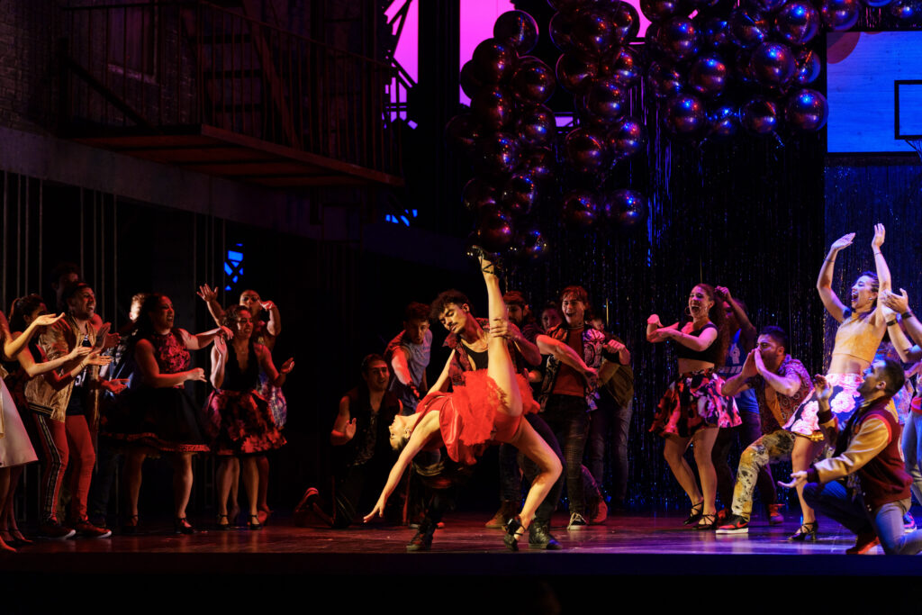 Yesenia Ayala as Anita and other cast members dancing at the final dress rehearsal of West Side Story presented by the Houston Grand Opera. (Photo by Michael Bishop)