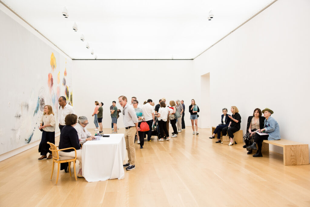 Artist Tacita Dean signs a copy of her book "Why Cy" during a book signing event at the Cy Twombly Gallery. (Photo by Hung Truong, courtesy The Menil Collection)