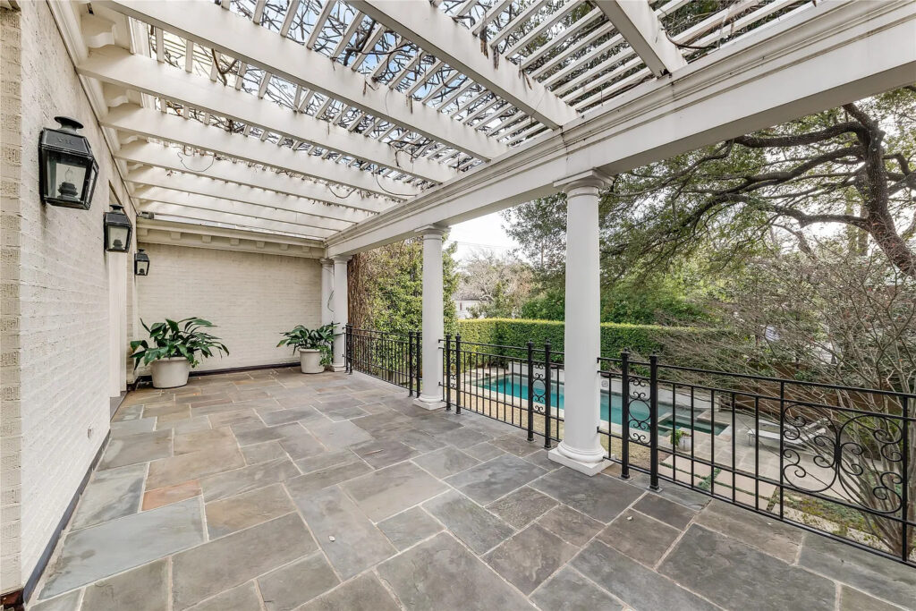 In the morning, throw open the drapes and French doors and take your Miele-brewed coffee on the vine-covered private terrace. (Photo by Allie Beth Allman & Associates)