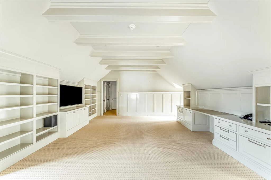 4226 Arcady Avenue's third level serves as a versatile retreat and includes a lounge area, game room, bathroom, and a large storage space. (Photo by Allie Beth Allman & Associates)