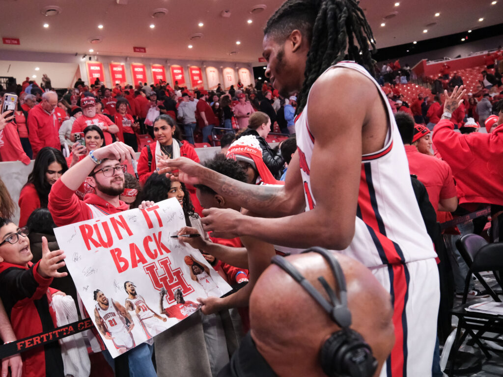 University of Houston forward JoJo Tugler embraces the Cougar fans. (Photo by F. Carter Smith)