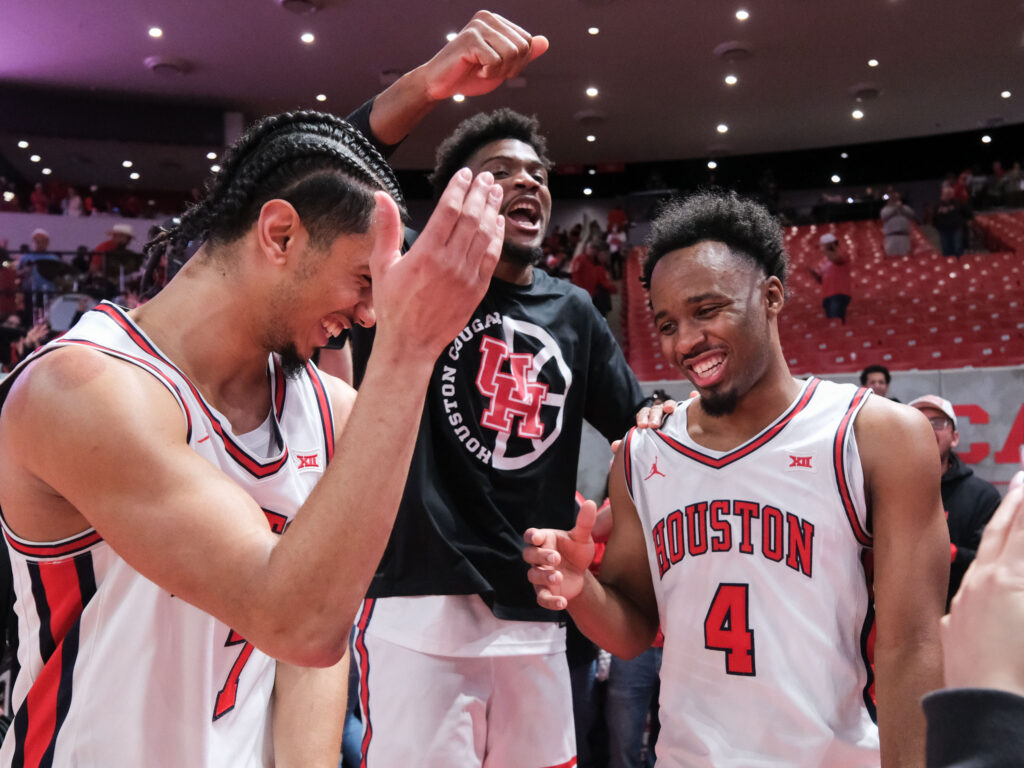 University of Houston players Milos Uzan, Cedric Lath and LJ Cryer share a fun moment. (Photo by F. Carter Smith)