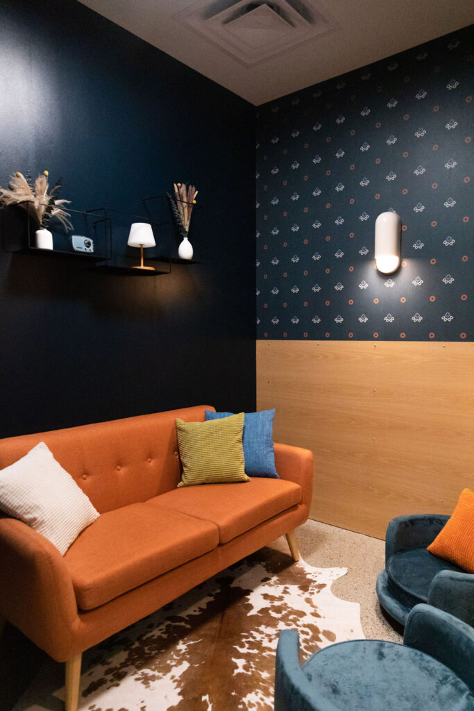 Delivering "an intimate and stress-free experience in an elevated environment," Yardstick's thoughtfully designed space includes a sofa lounge. (Photo courtesy of Yardstick)