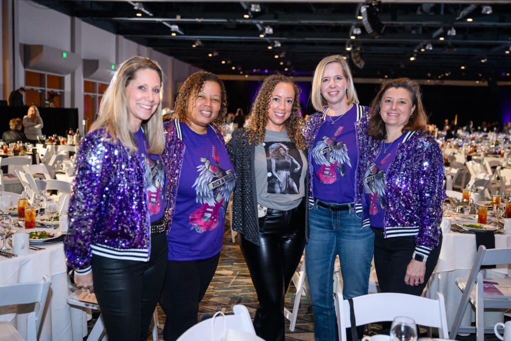 Glitter, glam and rock 'n roll were on display at the United Way's Women Who Rock luncheon at The Woodlands Waterway Marriott on March 7.