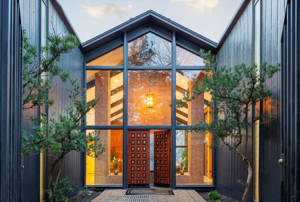 A harmonious flow between indoor and outdoor living stands out as an integral element of midcentury modern design. (Photo by Compass RE Texas)