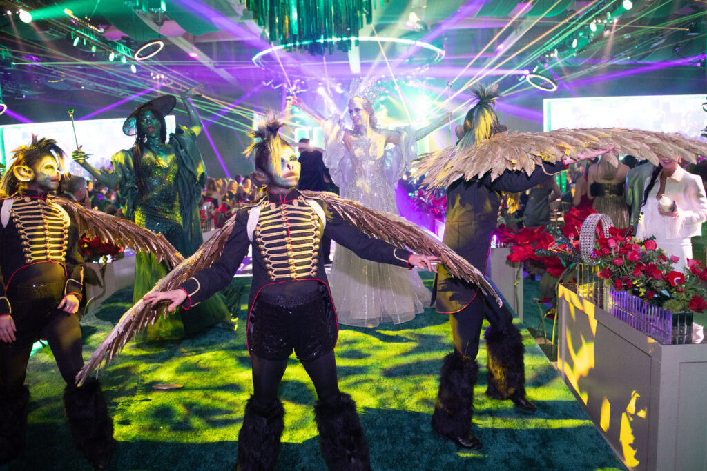 Flying monkeys a la 'Wicked' scurry through the San Luis Salute Mardi Gras bash. (Photo by Manny Chen)